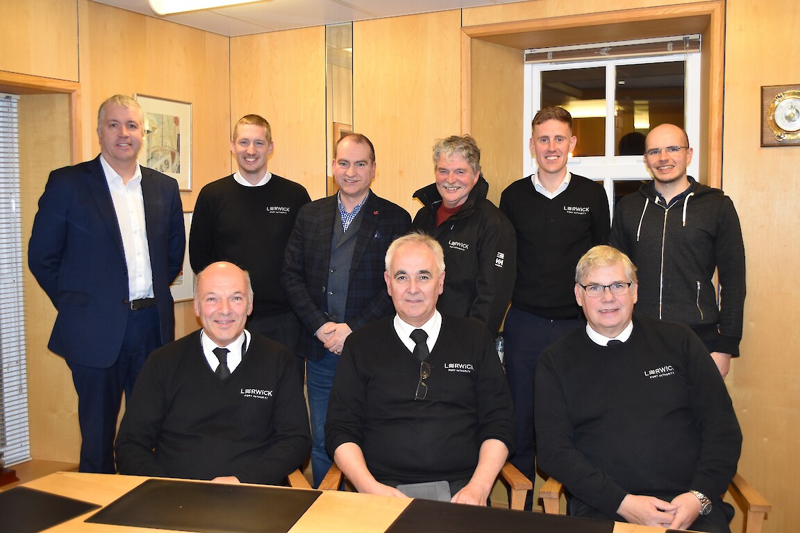 Calum Grains (Chief Executive); Iain Tulloch (Port Controller); Alexander Simpson (Harbourmaster), Charles Smith (Pilot); John McMeechan (Port Controller); Neil MacLean (Pilot); Neil Arthur (Deputy Harbourmaster); Ross Bray (Port Controller); Ellis Paton (Port Controller). Missing from the photo is Ryan Leith (Port Controller) and George White (Pilot).