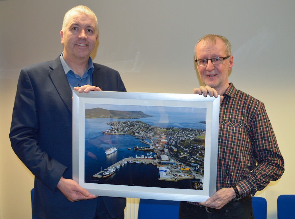 Calum Grains, Chief Executive (left) presented John Anderson (right) with a gift to commemorate his retirement.