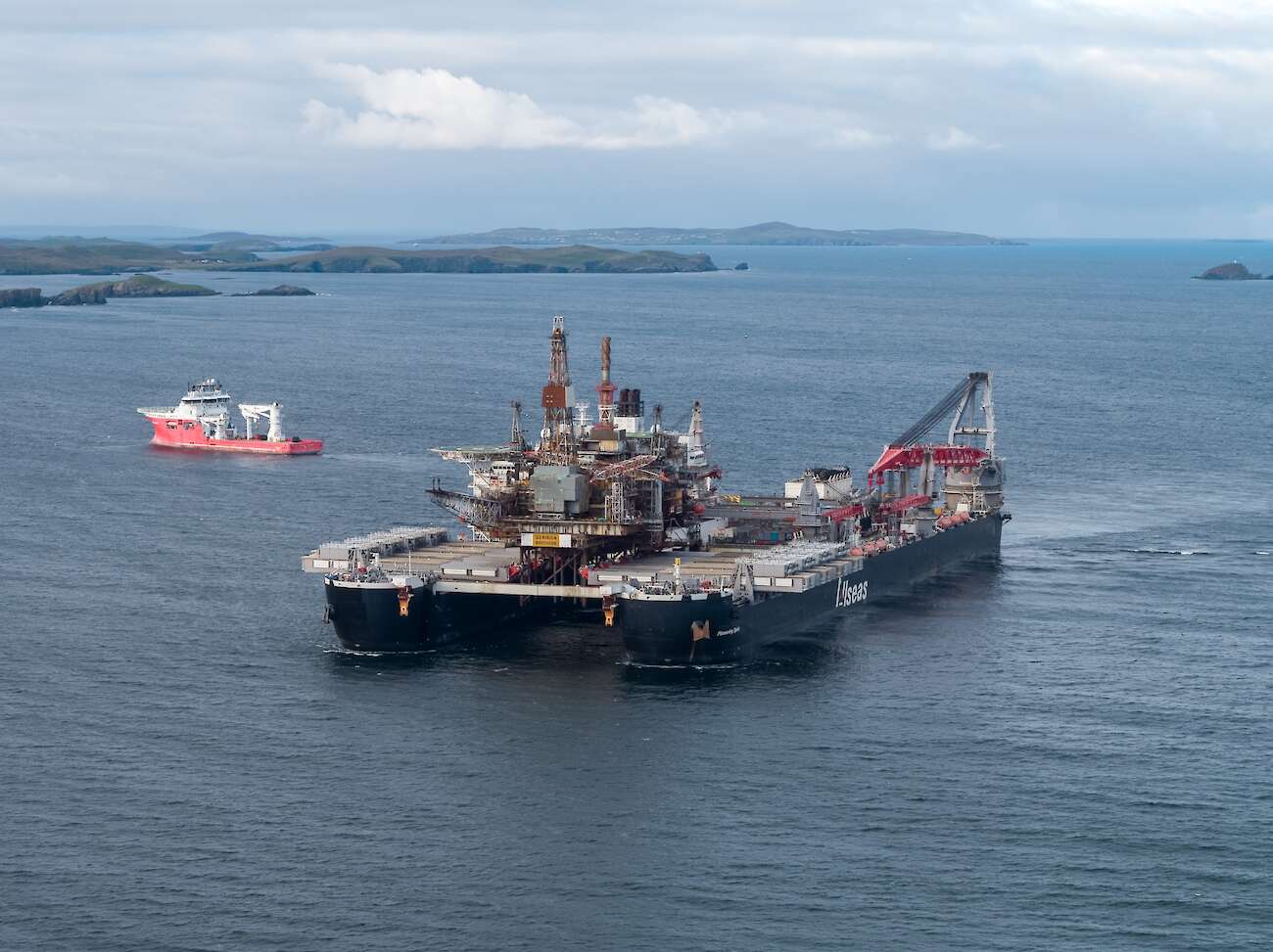 Lerwick, Shetland: Pioneering Spirit, the world’s largest construction vessel, arrives in Dales Voe with the 14,200 tonne Ninian Northern topside for decommissioning. Credit: Rory Gillies/Shetland Flyer Aerial Media.