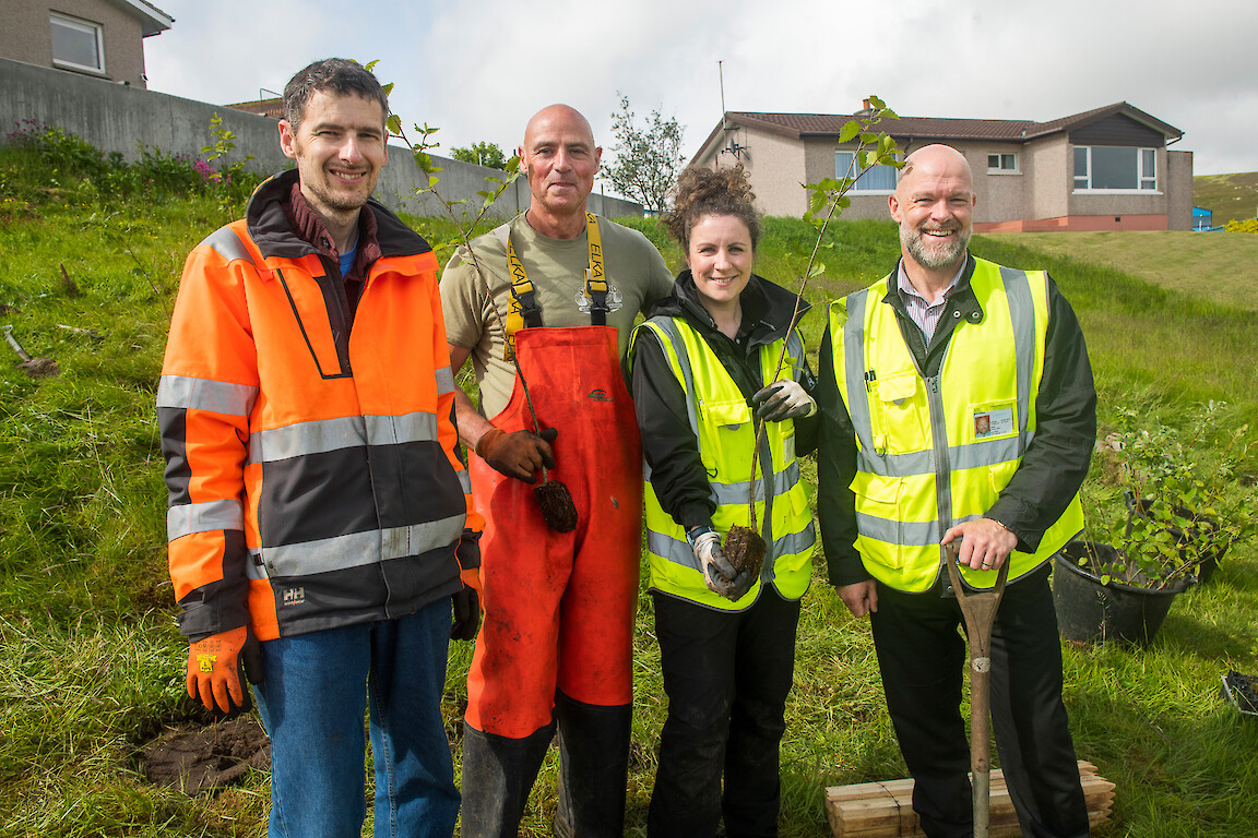 Tree planting at Holmsgarth Brae with Bell's Brae School, Shetland Amenity Trust and Viking Energy Windfarm Project.