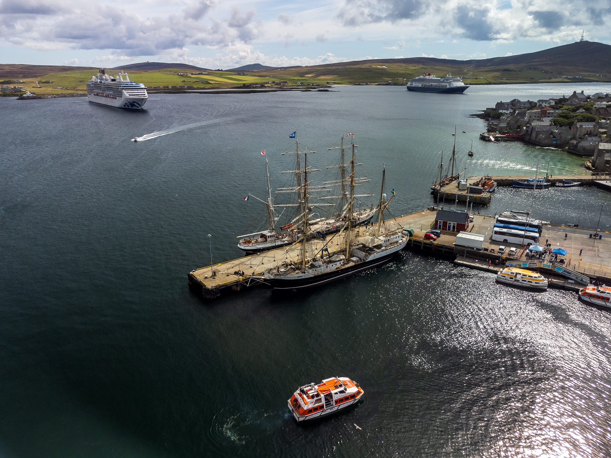Lerwick Harbour is set to welcome around 145 cruise ships this season and will host the spectacular Tall Ships Races in July 2023. Credit: Shetland Flyer Aerial Media  (Image at LateCruiseNews.com - February 2023)